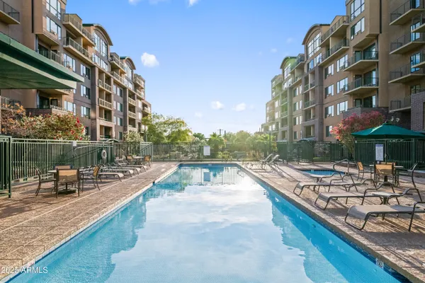 a view of a swimming pool with a patio