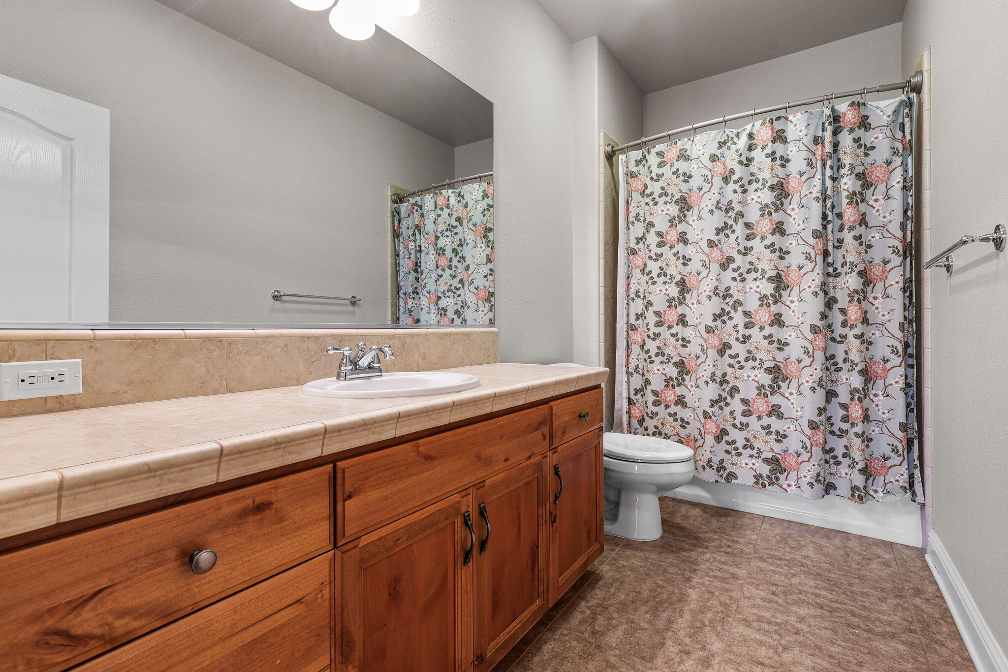 3641 Deuce Way Redding, CA 96002 - Photo 18 of 31 a bathroom with a double vanity sink toilet and shower