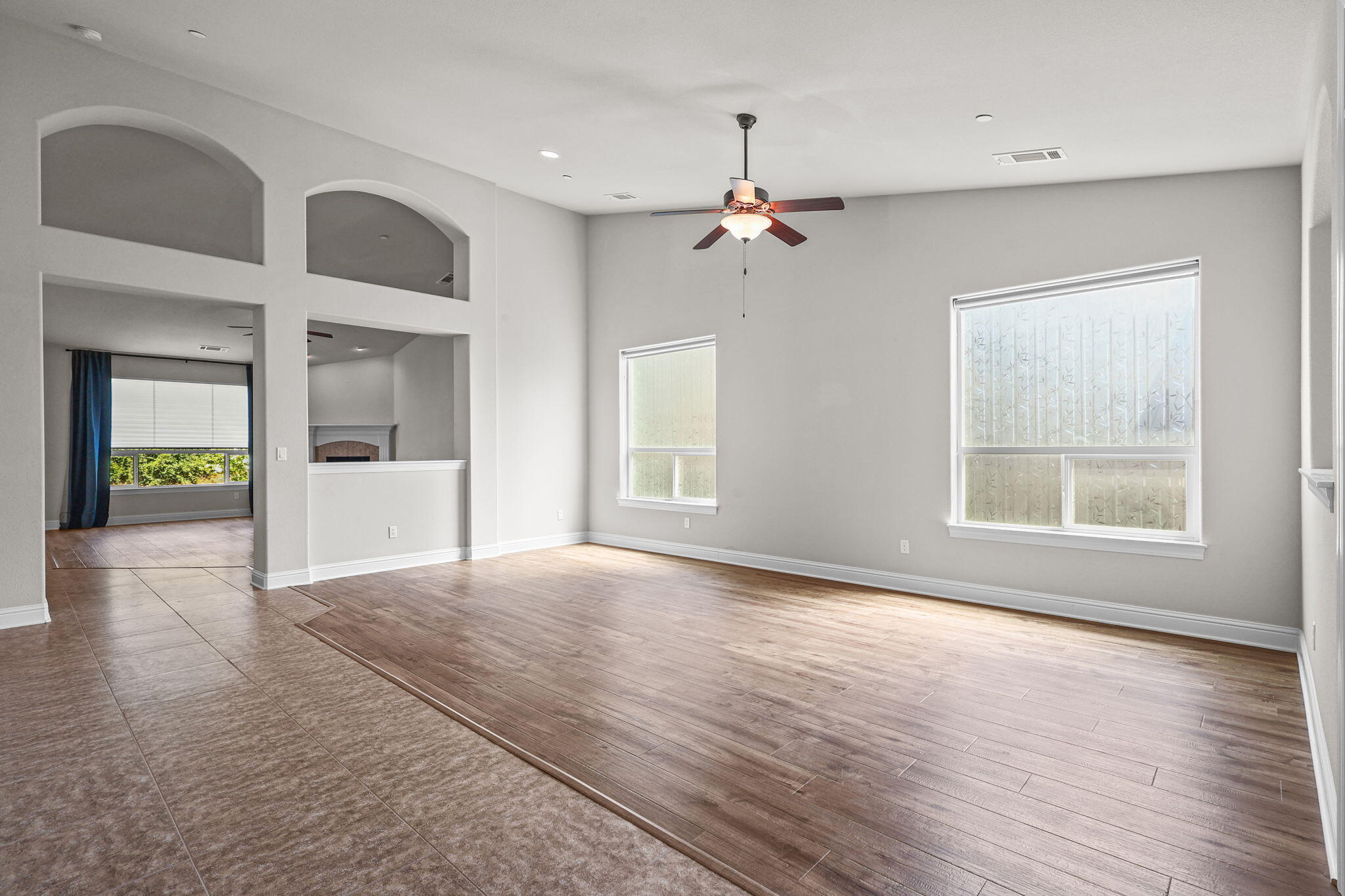 3641 Deuce Way Redding, CA 96002 - Photo 4 of 31 a view of an empty room with a window and wooden floor