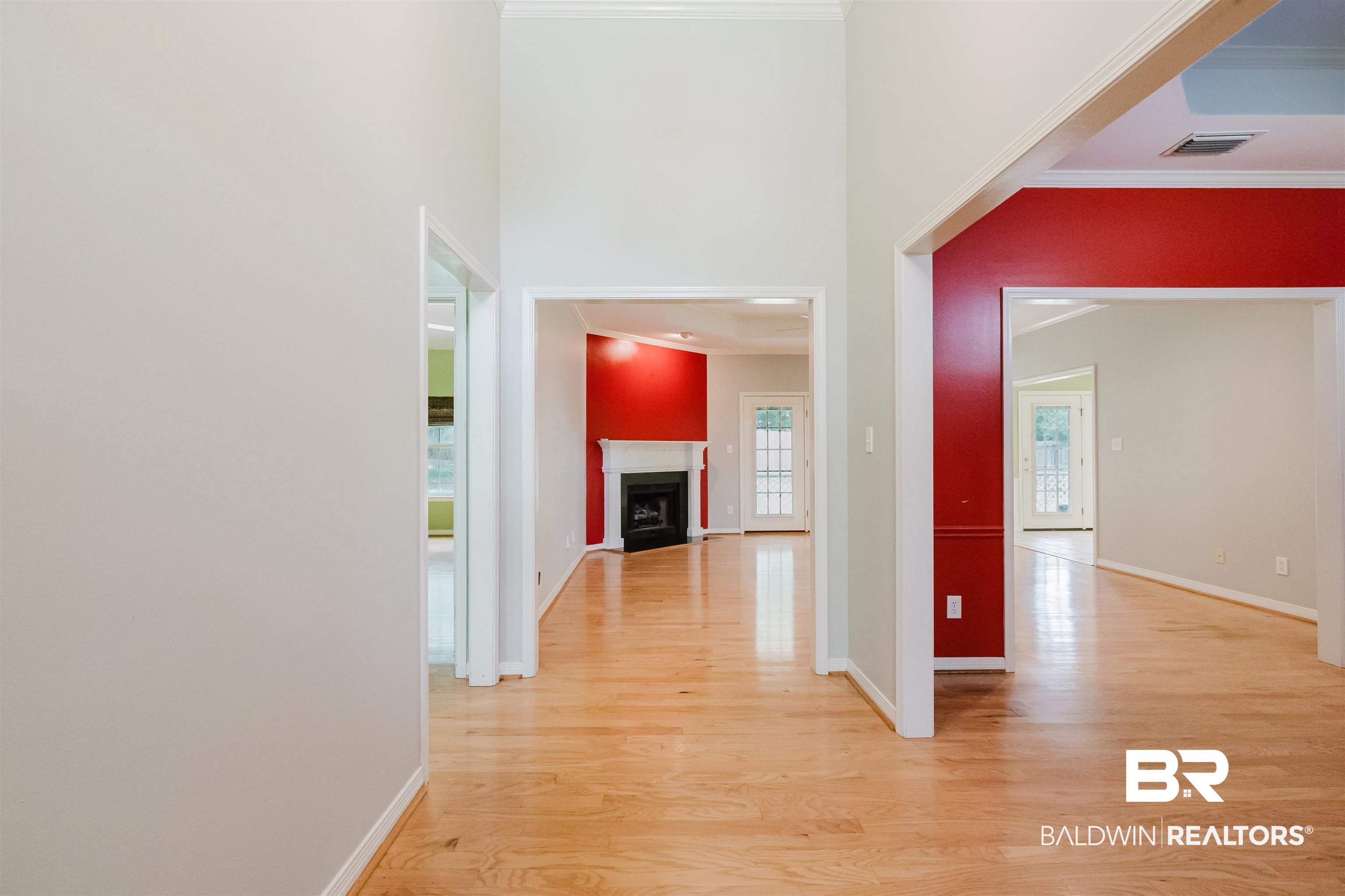 19711 Hunters Loop Fairhope, AL 36532 - Photo 6 of 49 Hallway featuring ornamental molding, light wood-type flooring, and baseboards