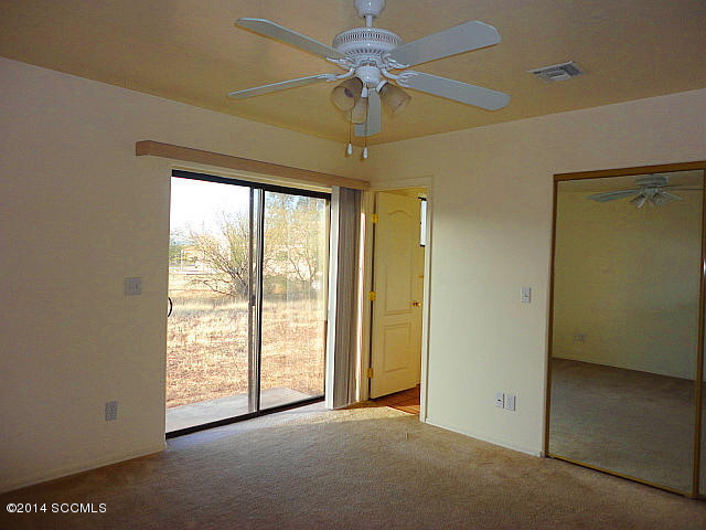 1688 Chapel Court Rio Rico, AZ 85648 - Photo 6 of 10 a view of an empty room with a window