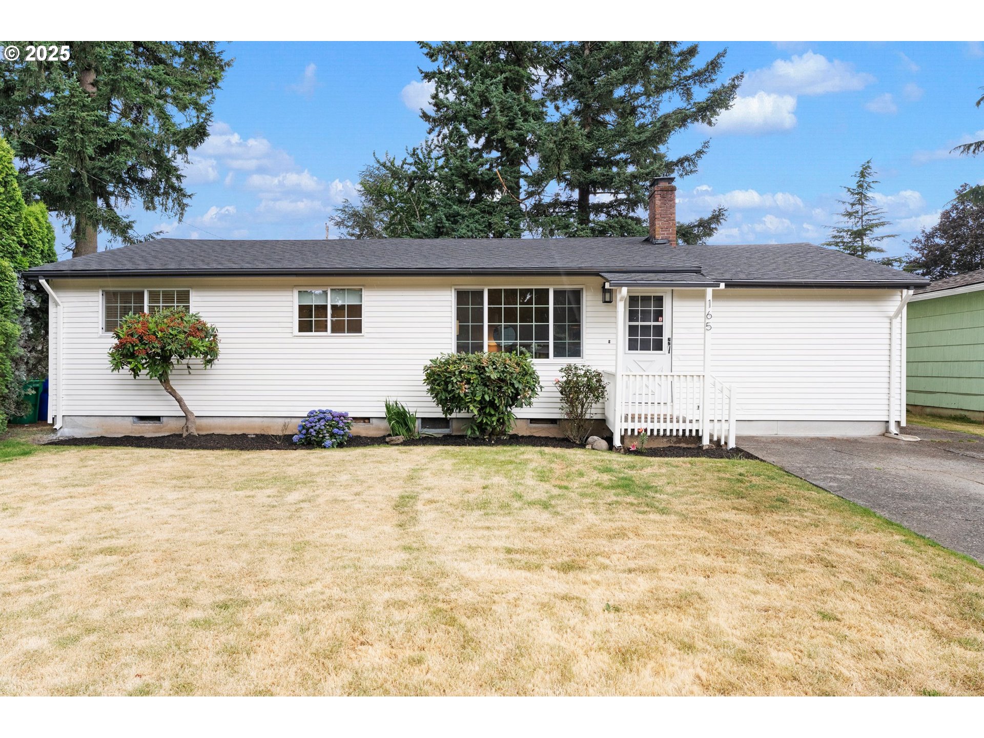 front view of a house with a yard