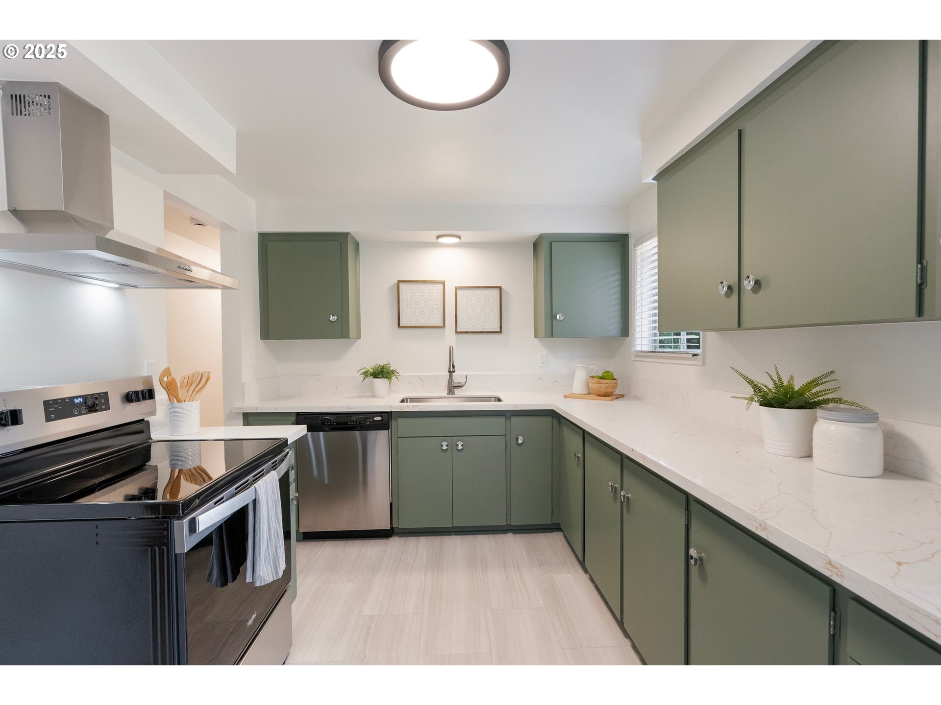 165 Northeast 167th Place Portland, OR 97230 - Photo 12 of 32 a kitchen with a sink stove and cabinets