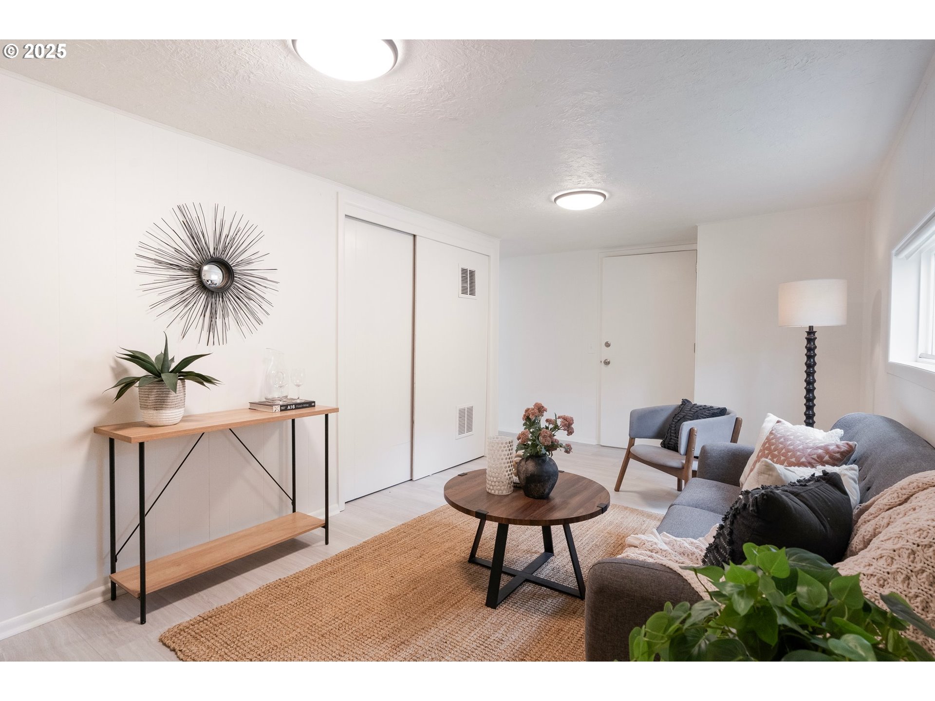 165 Northeast 167th Place Portland, OR 97230 - Photo 13 of 32 a living room with furniture and a potted plant