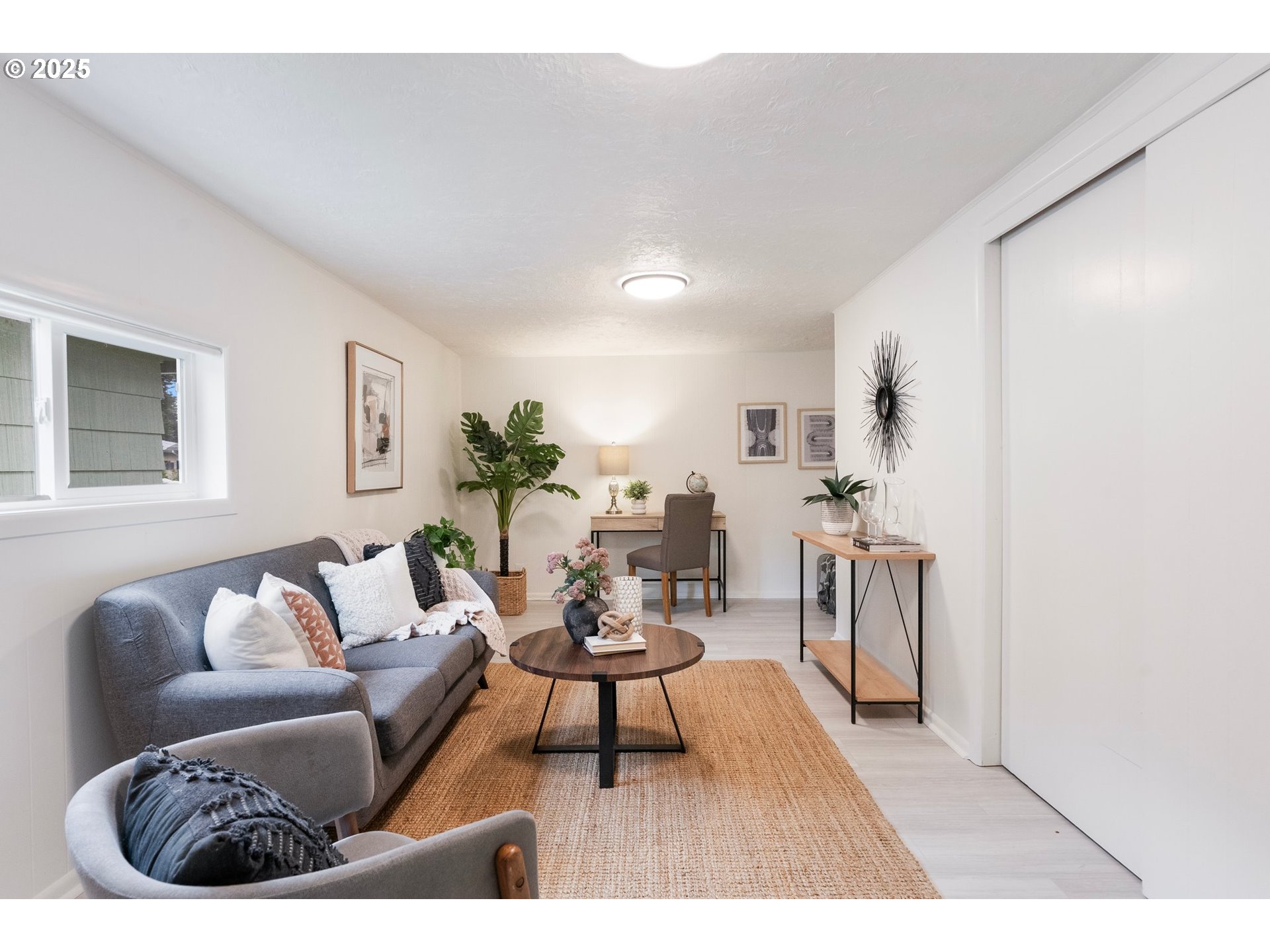 165 Northeast 167th Place Portland, OR 97230 - Photo 14 of 32 a living room with furniture a rug and a table