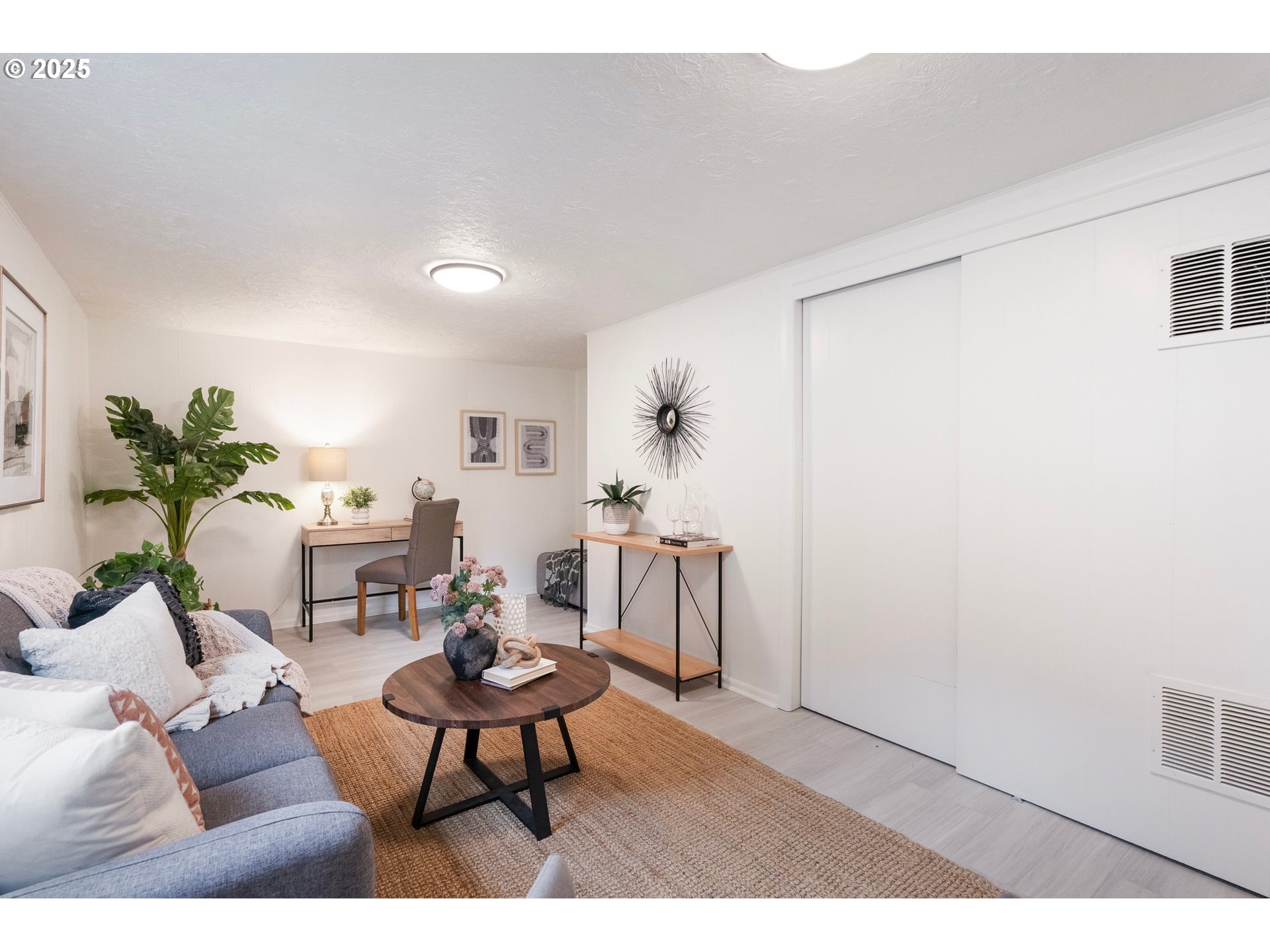 165 Northeast 167th Place Portland, OR 97230 - Photo 15 of 32 a living room with furniture a rug and a lamp
