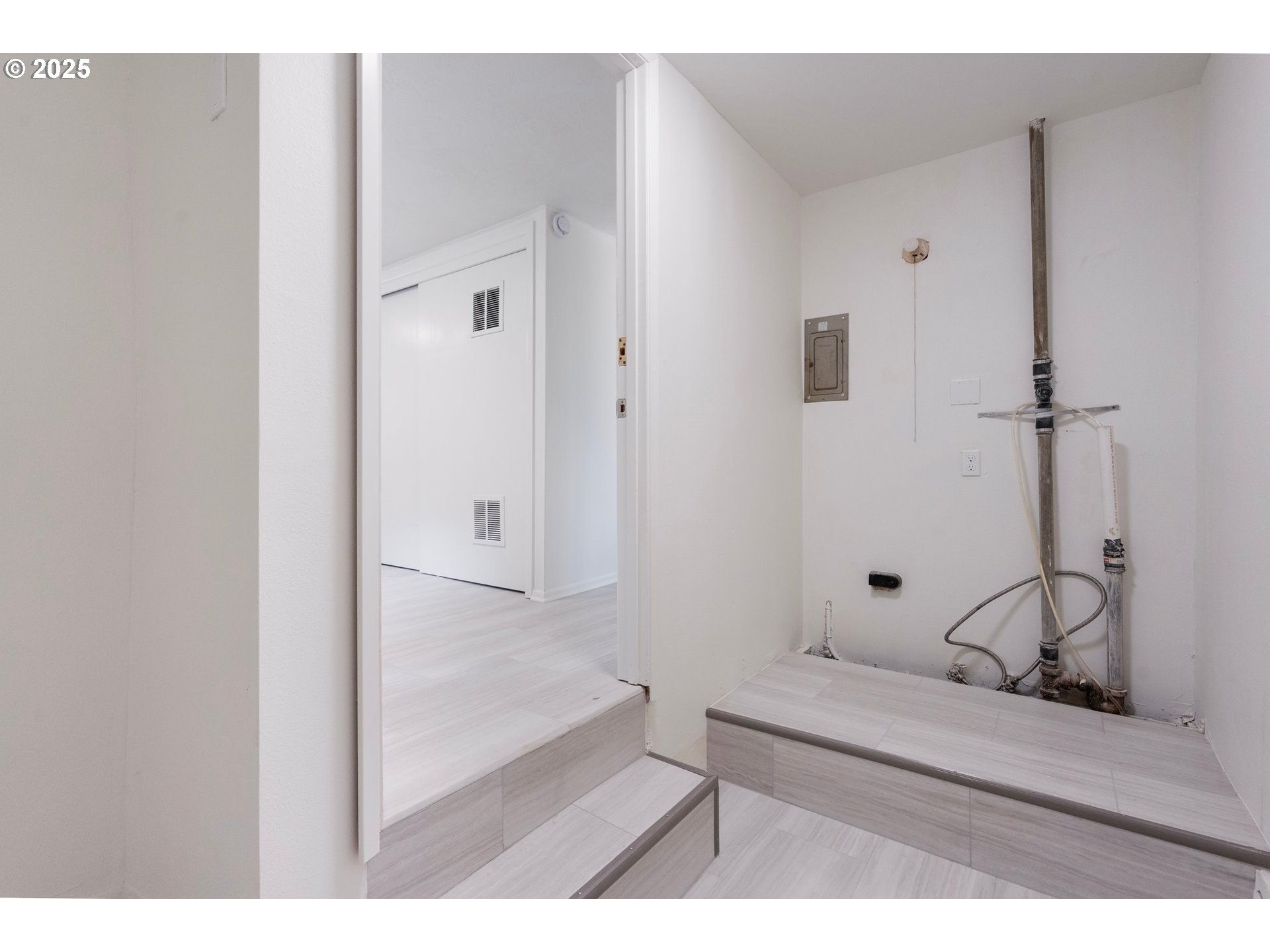 165 Northeast 167th Place Portland, OR 97230 - Photo 17 of 32 a view of bathroom with furniture and mirror
