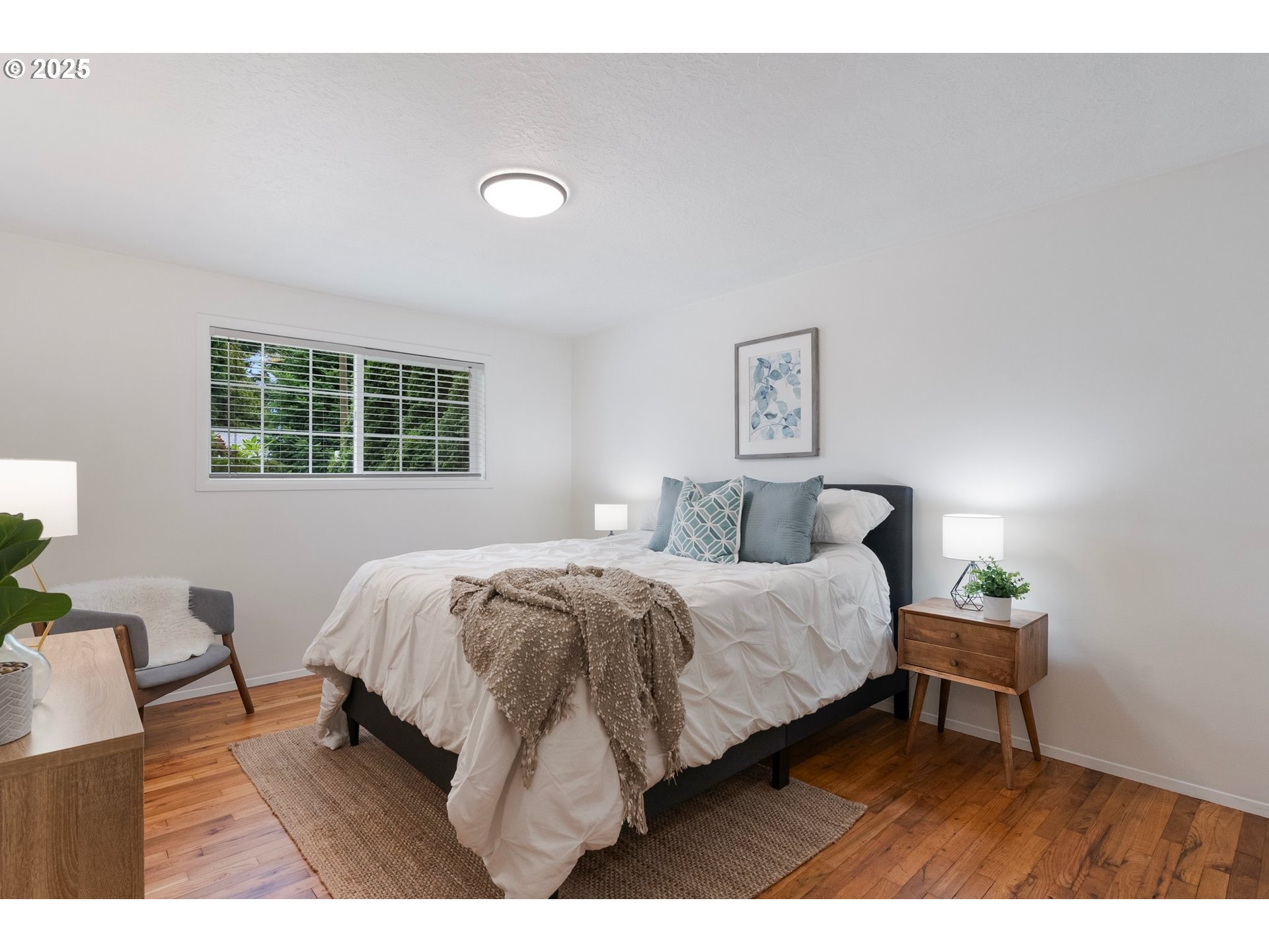 165 Northeast 167th Place Portland, OR 97230 - Photo 21 of 32 a bedroom with a bed window and a table