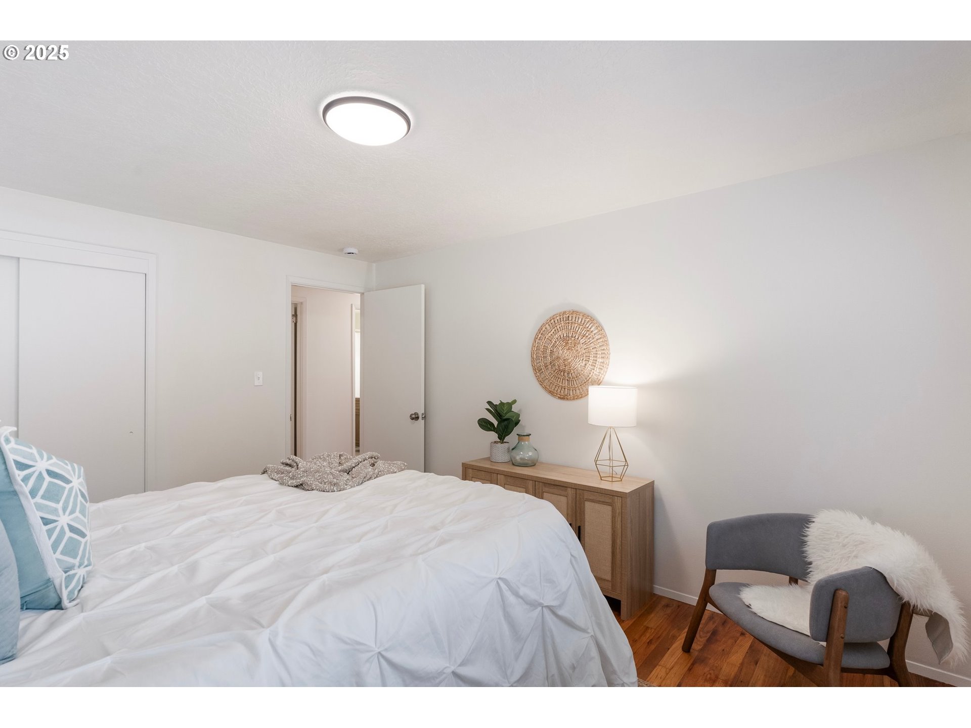 165 Northeast 167th Place Portland, OR 97230 - Photo 22 of 32 a bedroom with a bed and a lamp