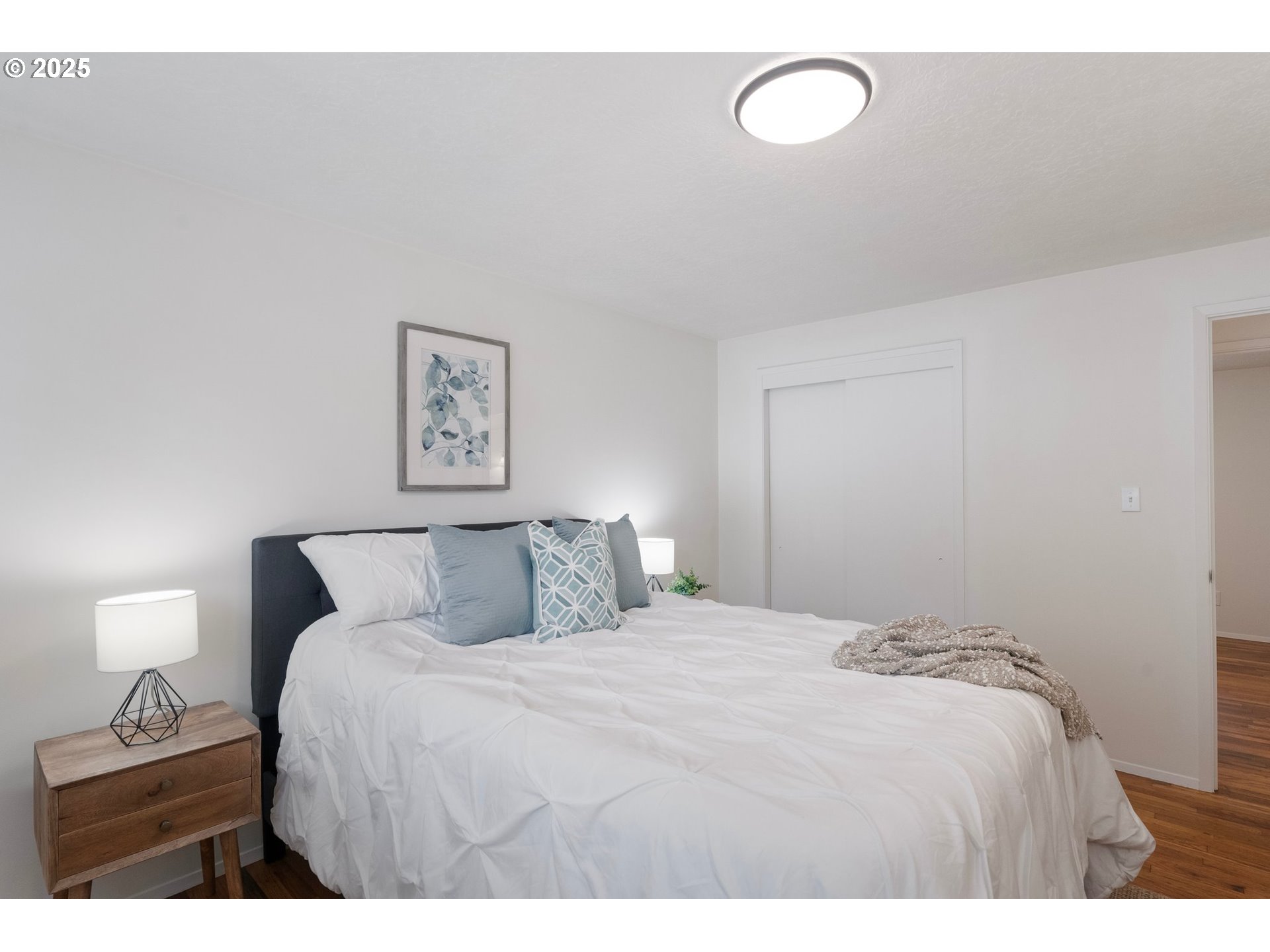 165 Northeast 167th Place Portland, OR 97230 - Photo 23 of 32 a bedroom with a bed and a night stand