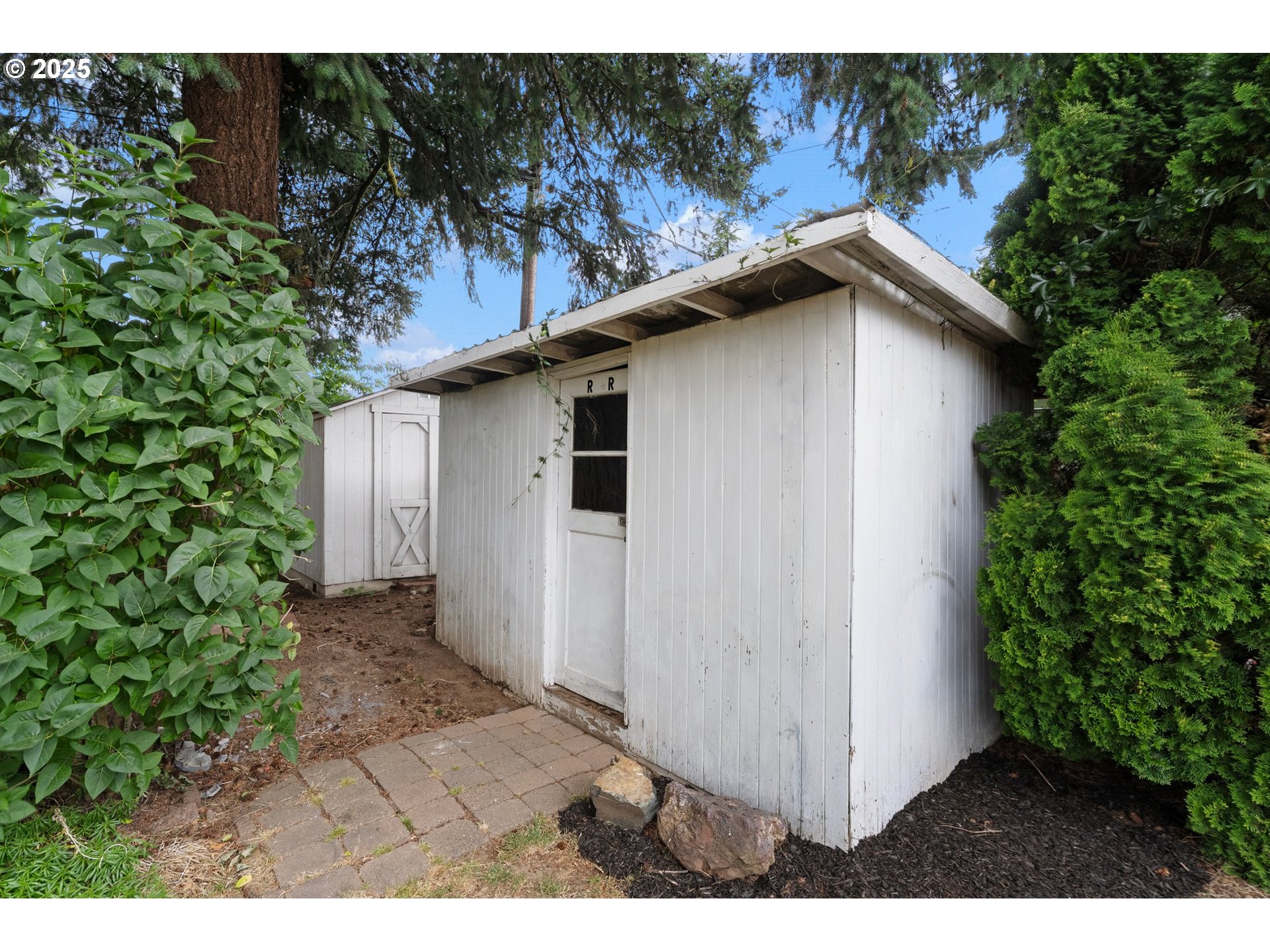 165 Northeast 167th Place Portland, OR 97230 - Photo 29 of 32 a white house with tree in the background