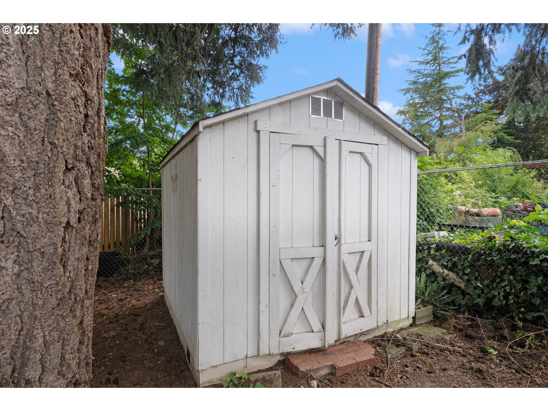 165 Northeast 167th Place Portland, OR 97230 - Photo 30 of 32 a view of a wooden house with a small yard