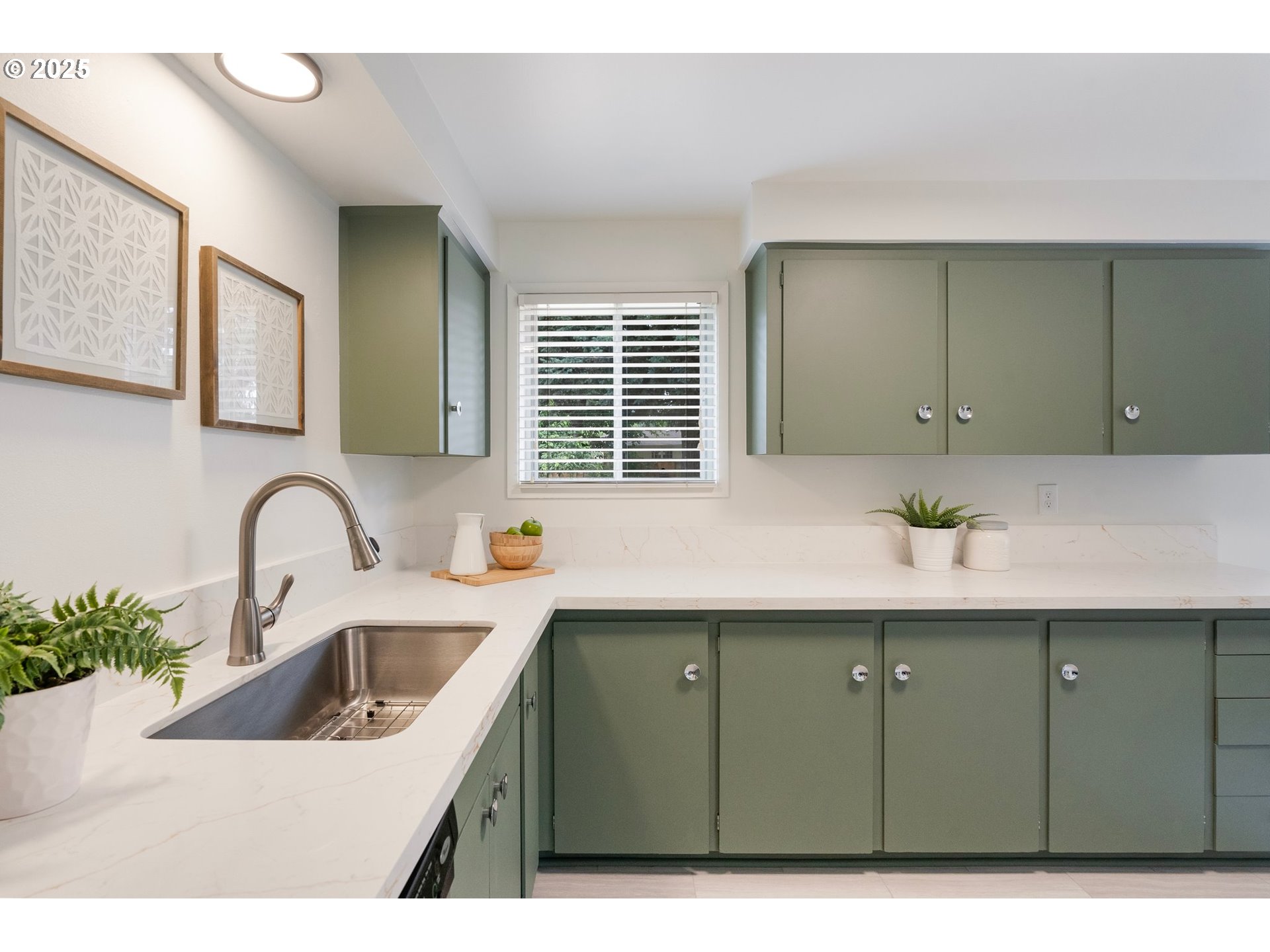165 Northeast 167th Place Portland, OR 97230 - Photo 10 of 32 a kitchen with a sink and cabinets