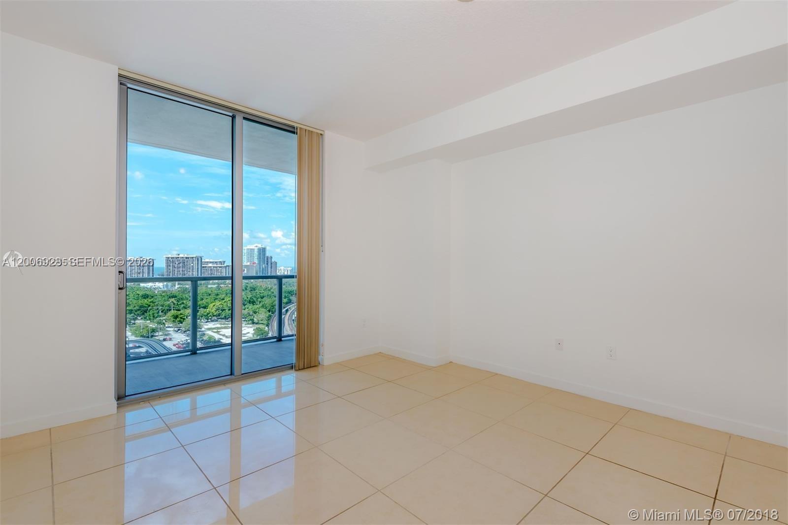 79 Southwest 12th Street, Unit 1903 Miami, FL 33130 - Photo 7 of 25 an empty room with windows