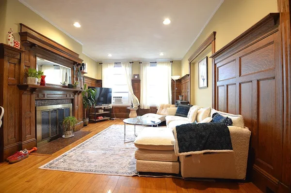 a dining room with stainless steel appliances kitchen island a table and chairs