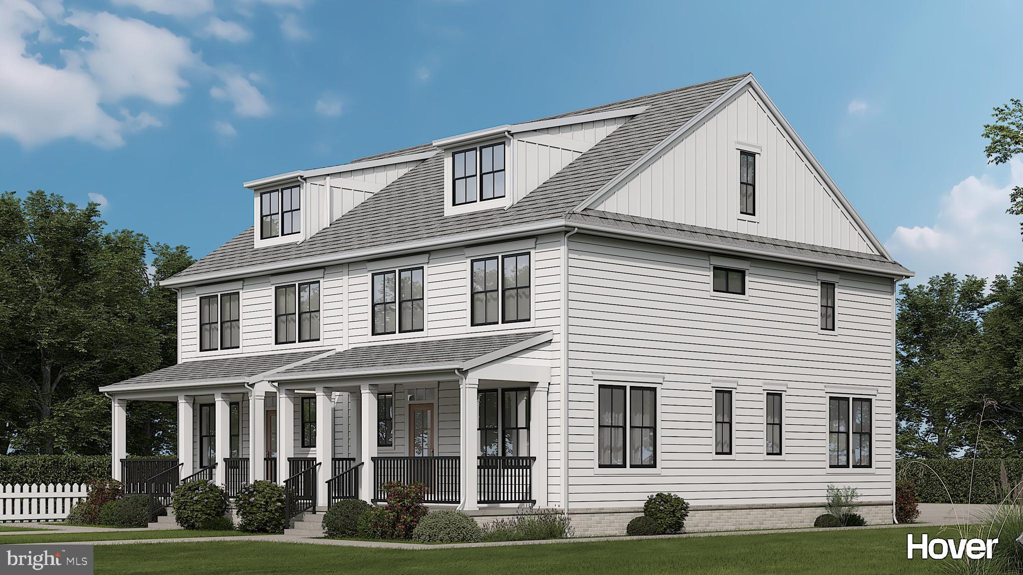 453 East Franklin Street, Unit TWIN Media, PA 19063 - Photo 2 of 9 a view of a white house with large windows and a yard