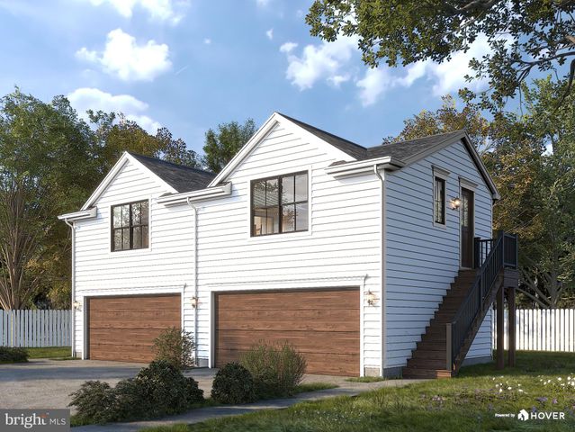 a view of house with backyard