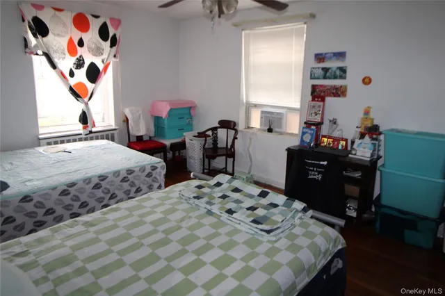 a bedroom with a bed and dresser