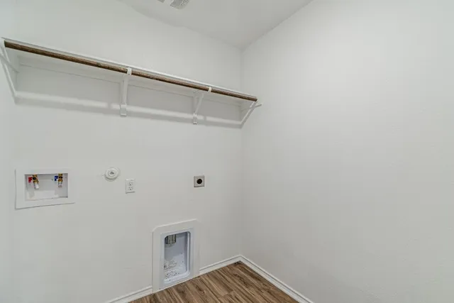a bathroom with a tub sink shower and mirror