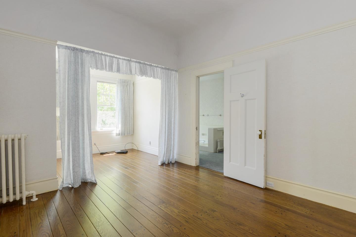 16 Maple Avenue Atherton, CA 94027 - Photo 18 of 25 an empty room with wooden floor and windows