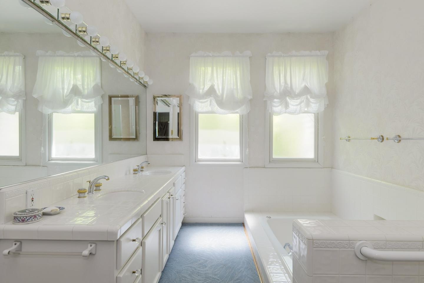 16 Maple Avenue Atherton, CA 94027 - Photo 20 of 25 a bathroom with a double vanity sink a toilet and a tub
