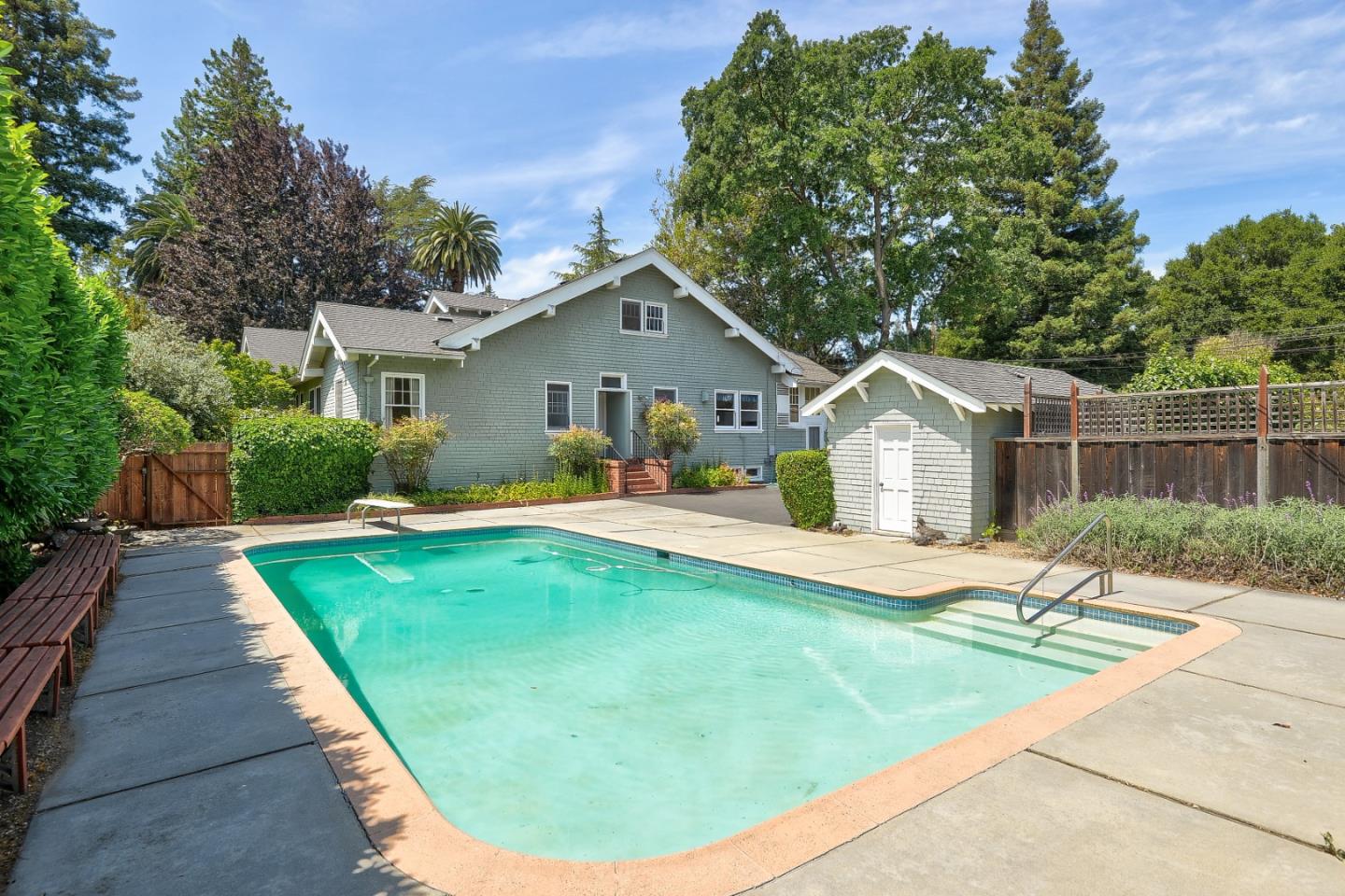 16 Maple Avenue Atherton, CA 94027 - Photo 3 of 25 a view of a house with a swimming pool and a yard