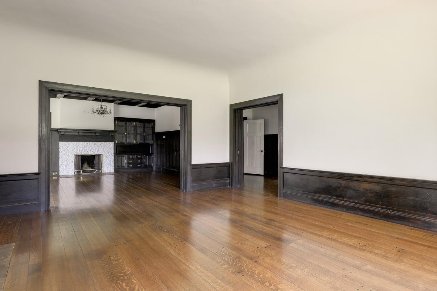 16 Maple Avenue Atherton, CA 94027 - Photo 9 of 25 a view of empty room with wooden floor and fireplace