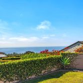 an aerial view of a houses with a yard