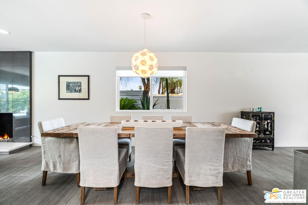 73428 Little Bend Trail Palm Desert, CA 92260 - Photo 11 of 46 a view of a dining room with furniture and wooden floor
