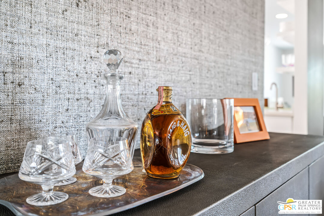 73428 Little Bend Trail Palm Desert, CA 92260 - Photo 13 of 46 a room with a wooden floor and a potted plant