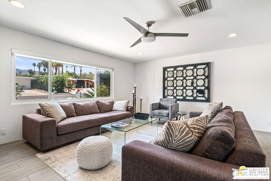 73428 Little Bend Trail Palm Desert, CA 92260 - Photo 14 of 46 a living room with furniture and a large window