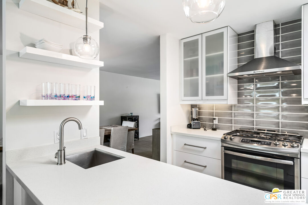 73428 Little Bend Trail Palm Desert, CA 92260 - Photo 17 of 46 a kitchen with a sink and a stove top oven