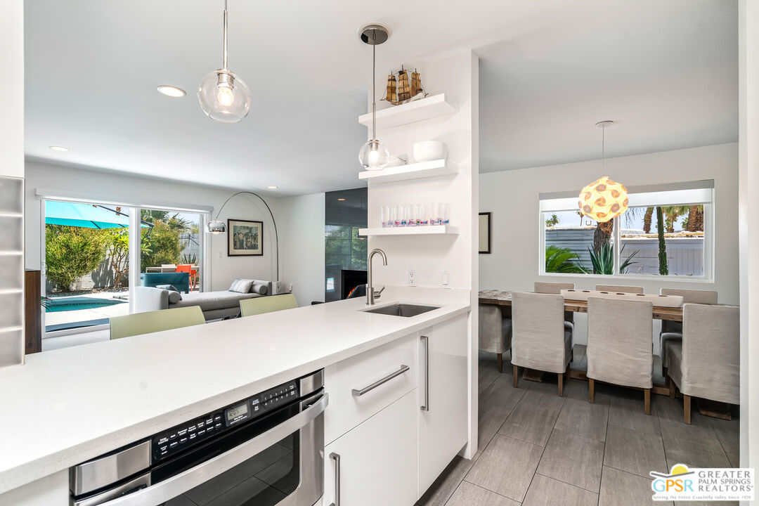 73428 Little Bend Trail Palm Desert, CA 92260 - Photo 20 of 46 a kitchen that has a lot of cabinets in it and wooden floor