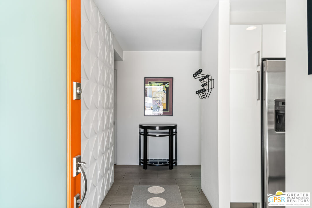 73428 Little Bend Trail Palm Desert, CA 92260 - Photo 21 of 46 a view of an entryway with wooden floor and a livingroom