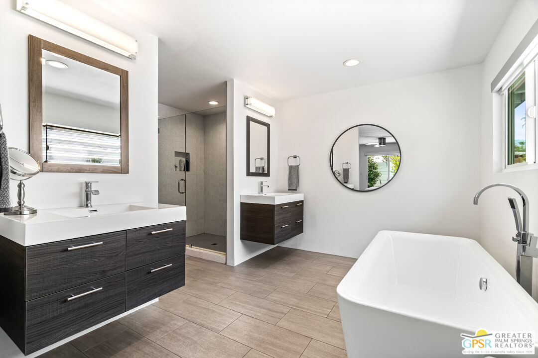 73428 Little Bend Trail Palm Desert, CA 92260 - Photo 25 of 46 a en suite bathroom with a double vanity sink and a mirror