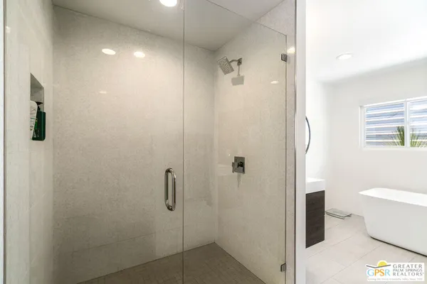a bathroom with a shower and a toilet
