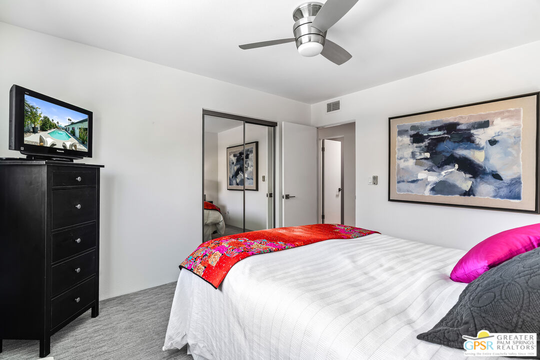73428 Little Bend Trail Palm Desert, CA 92260 - Photo 31 of 46 a bedroom with a bed and a painting on the wall