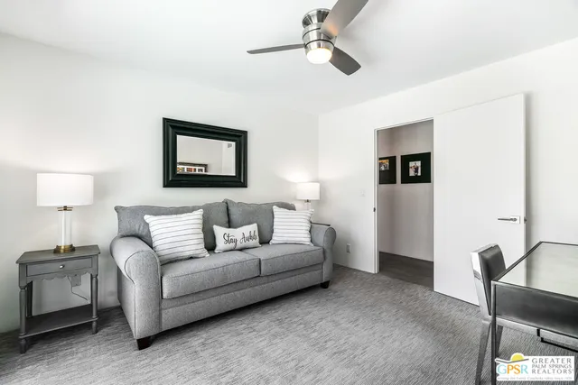a living room with furniture and a window