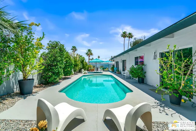 a view of a swimming pool with a patio