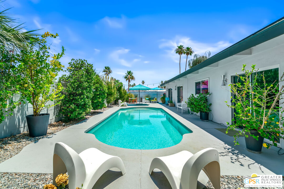 73428 Little Bend Trail Palm Desert, CA 92260 - Photo 40 of 46 a swimming pool with outdoor seating yard and green space