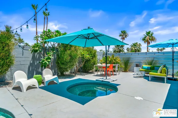 a outdoor living space with furniture and city view