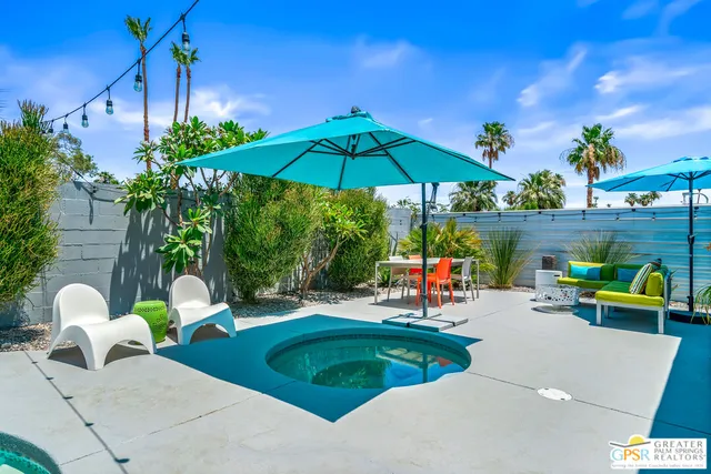 a outdoor living space with furniture and city view