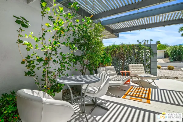 a view of a balcony with chairs