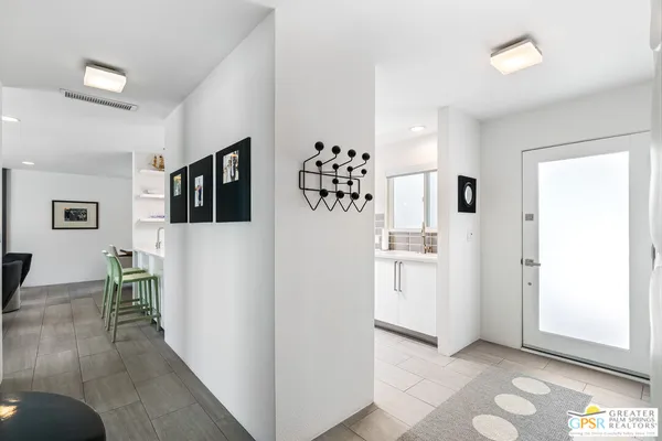 a view of kitchen with furniture and wooden floor