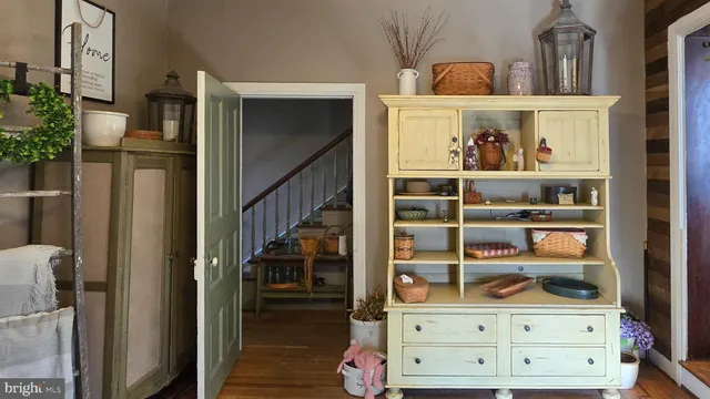 a view of a livingroom with furniture a chandelier and closet