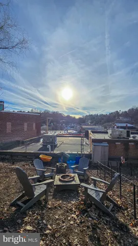a kitchen view with living room stove and oven