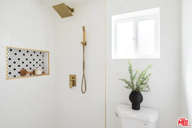 a white vase with white flowers