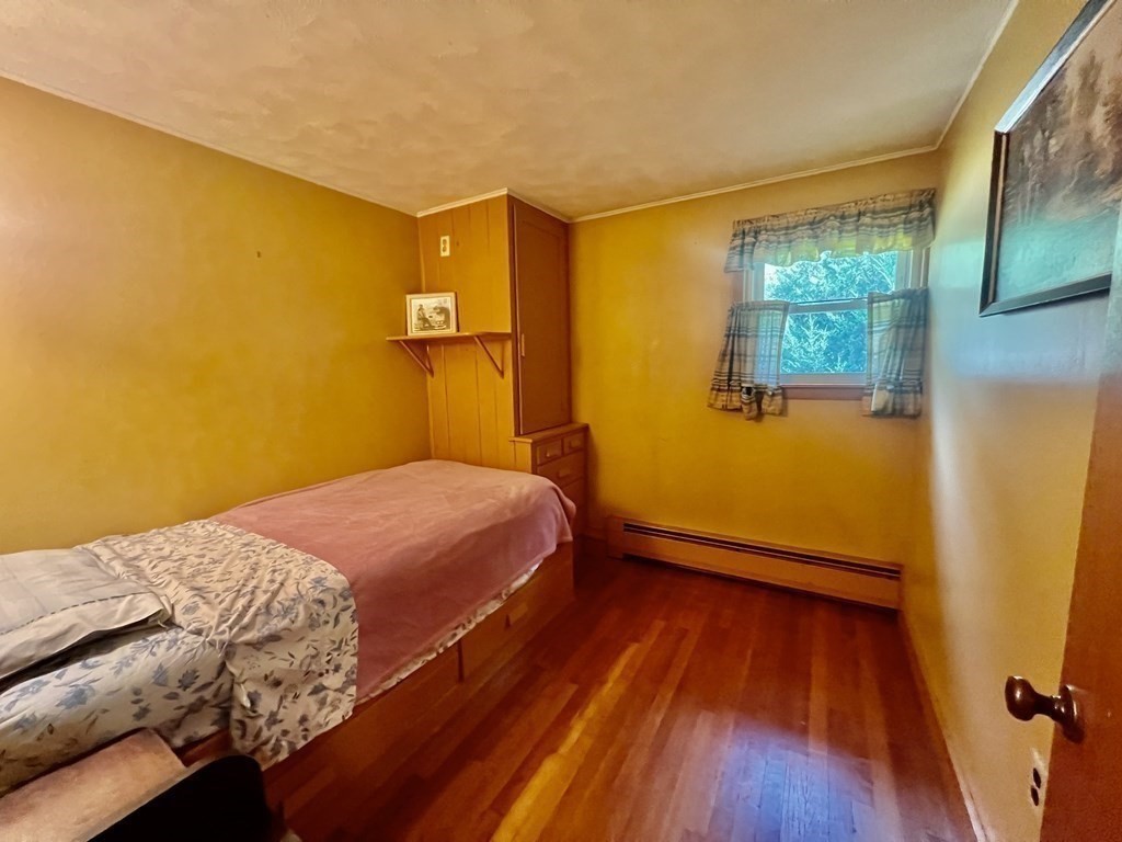 11 Tower Road Ashland, MA 01721 - Photo 18 of 31 a bedroom with a bed and wooden floor