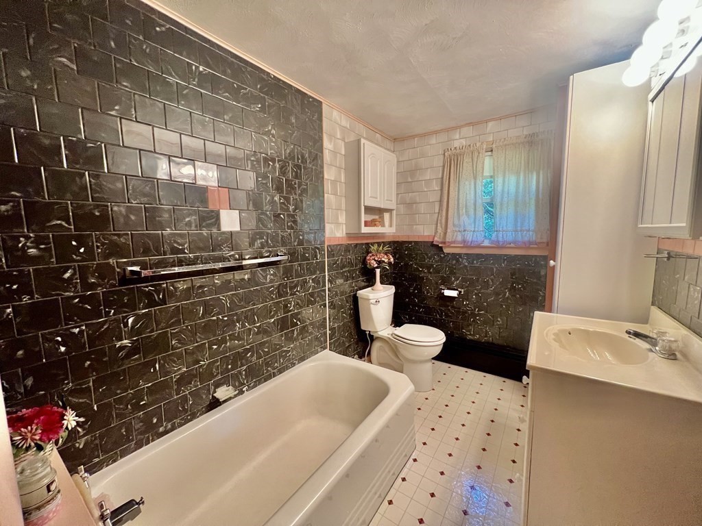 11 Tower Road Ashland, MA 01721 - Photo 25 of 31 a bathroom with a sink toilet and shower