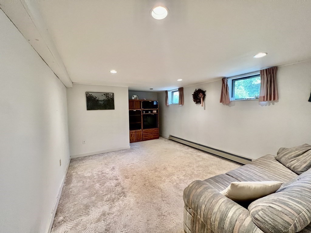 11 Tower Road Ashland, MA 01721 - Photo 27 of 31 a view of a livingroom with furniture and a ceiling fan
